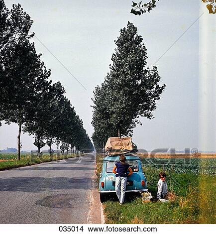 People parked at the side of the road for a picnic View Large Photo Image Picture - People parked at the side of the road for a picnic. Fotosearch