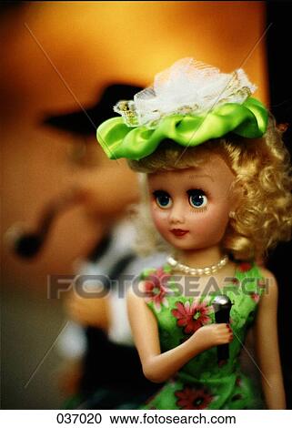 A doll holding a microphone View Large Photo Image Stock Image - A doll holding a microphone. Fotosearch