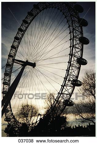 A ferris wheel at dusk View Large Photo Image Stock Photo - A ferris wheel at dusk. Fotosearch
