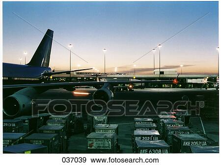 Stock Photo - An airplane parked at an airport. Fotosearch