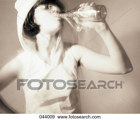 A woman drinking View Large Photo Image Stock Photo - A woman drinking. Fotosearch