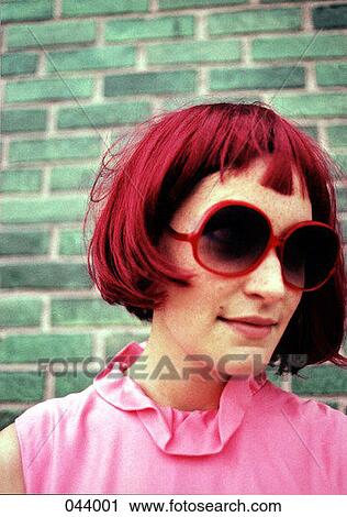 A woman with bright pink hair, pink shirt, and red sunglasses View Large Photo Image Stock Image - A woman with bright pink hair, pink shirt, and red sunglasses. Fotosearch