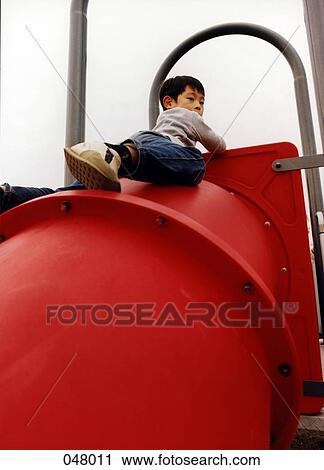 boy climbing playground equipment View Large Photo Image Stock Image - boy climbing playground equipment. Fotosearch