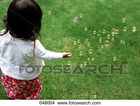 girl catching bubbles View Large Photo Image Picture - girl catching bubbles. Fotosearch