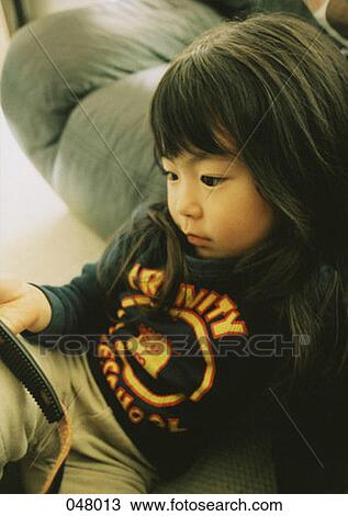 Girl resting on couch View Large Photo Image Stock Image - Girl resting on couch. Fotosearch