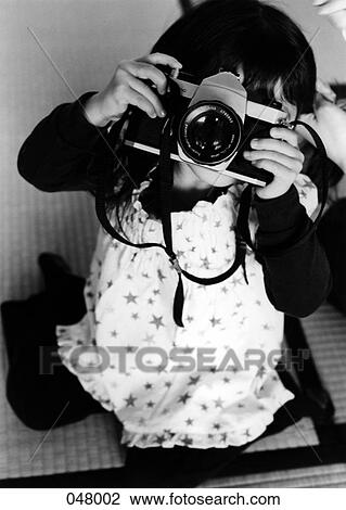 girl taking a picture View Large Photo Image Stock Image - girl taking a picture. Fotosearch