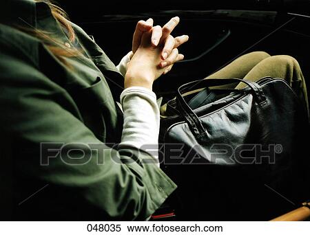 woman sitting in a car with handbag View Large Photo Image Stock Photography - woman sitting in a car with handbag. Fotosearch