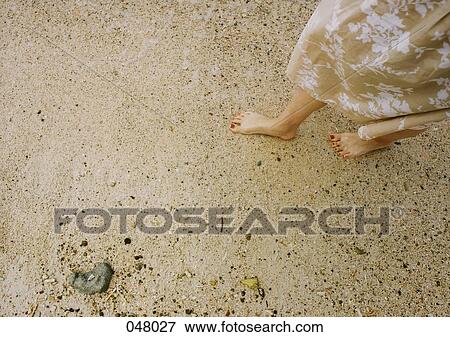 woman's feet on a sandy beach View Large Photo Image Stock Photo - woman's feet on a sandy beach. Fotosearch