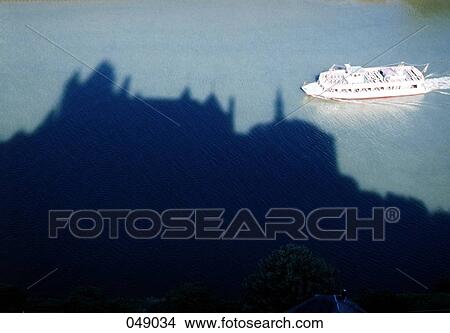 boat crossing the shadow of a castle View Large Photo Image Picture - boat crossing the shadow of a castle. Fotosearch