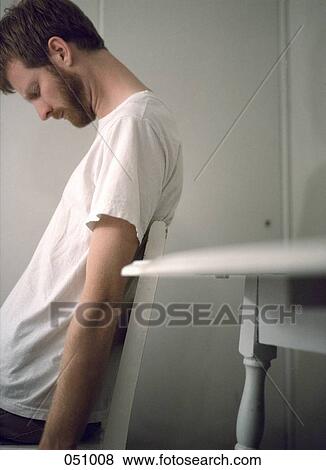 A man sleeping on a chair View Large Photo Image Stock Photo - A man sleeping on a chair. Fotosearch