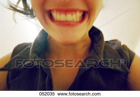 A young woman smiling View Large Photo Image Stock Photography - A young woman smiling. Fotosearch