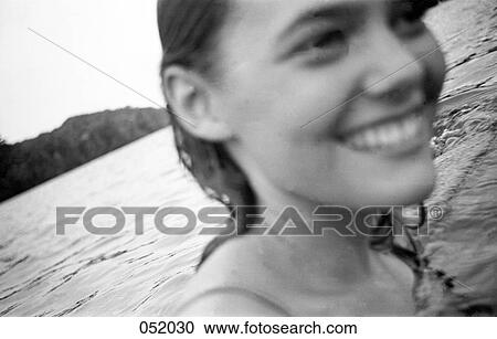 A young woman swimming in a lake View Large Photo Image Stock Image - A young woman swimming in a lake. Fotosearch