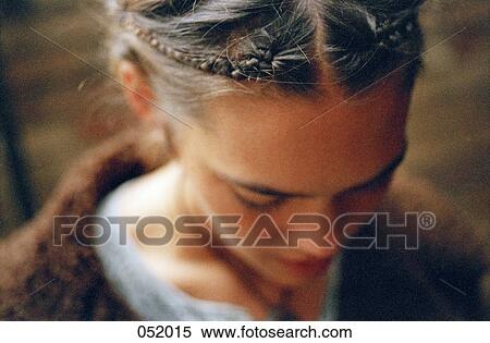 Braids in a young woman's hair View Large Photo Image Stock Photography - Braids in a young woman's hair. Fotosearch