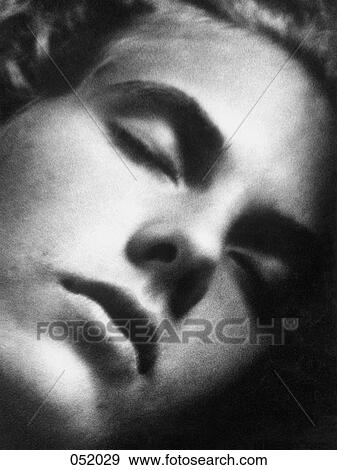 The face of a young man sleeping View Large Photo Image Stock Photo - The face of a young man sleeping. Fotosearch