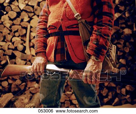 A hunter's torso and shotgun View Large Photo Image Stock Photograph - A hunter's torso and shotgun. Fotosearch