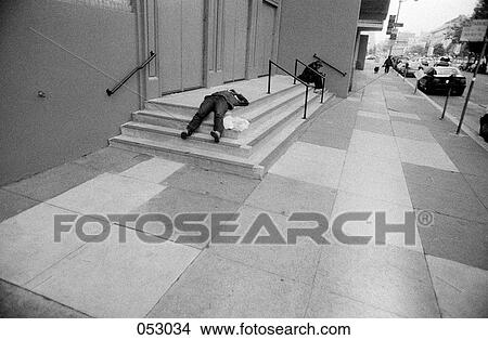 A man lying on concrete steps View Large Photo Image Picture - A man lying on concrete steps. Fotosearch