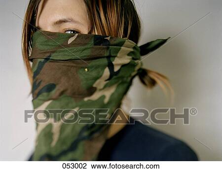 A young man with a bandana covering his face View Large Photo Image Stock Image - A young man with a bandana covering his face. Fotosearch