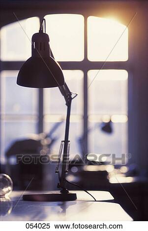 A lamp on a desk View Large Photo Image Stock Photography - A lamp on a desk. Fotosearch