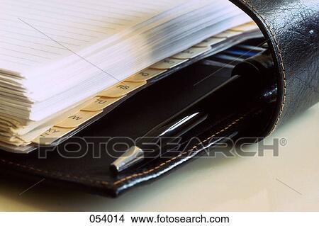 An organizer and pen View Large Photo Image Picture - An organizer and pen. Fotosearch