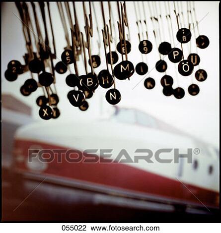 Stock Image - A collage featuring typewriter parts and a train. Fotosearch