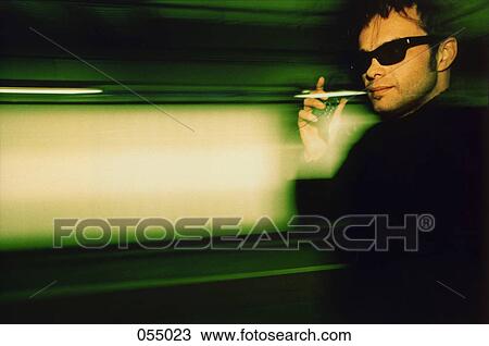 A man talking on a cell phone View Large Photo Image Stock Image - A man talking on a cell phone. Fotosearch