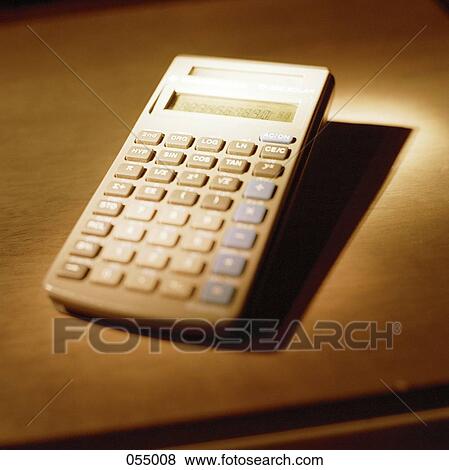 Stock Photo - A retro calculator on a table. Fotosearch