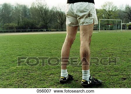 A man standing on a soccer field View Large Photo Image Stock Photo - A man standing on a soccer field. Fotosearch