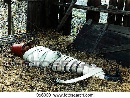 Stock Image - A man wrapped in a fire hose. Fotosearch