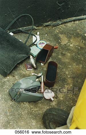 The contents of a handbag spilled out View Large Photo Image Stock Photograph - The contents of a handbag spilled out. Fotosearch