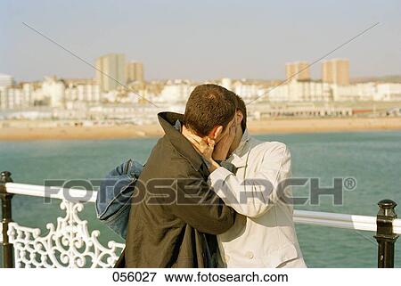 Two men kissing View Large Photo Image Stock Photo - Two men kissing. Fotosearch