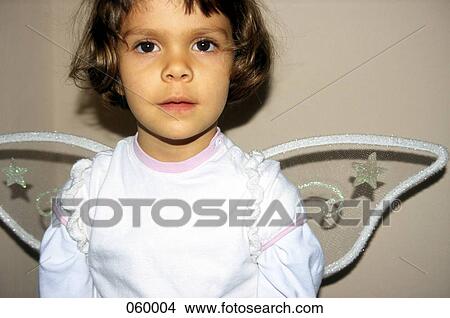 A girl dressed as an angel View Large Photo Image Picture - A girl dressed as an angel. Fotosearch