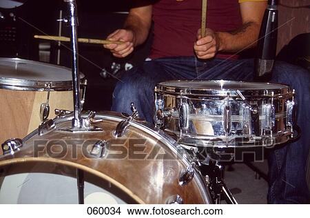 A man playing drums View Large Photo Image Picture - A man playing drums. Fotosearch