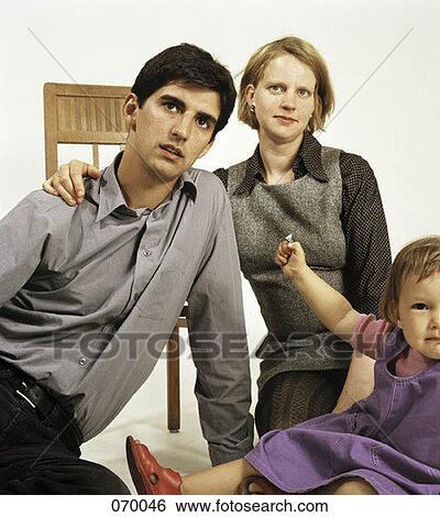 A family of three View Large Photo Image Stock Photograph - A family of three. Fotosearch