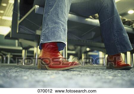 A person wearing red boots View Large Photo Image Stock Image - A person wearing red boots. Fotosearch