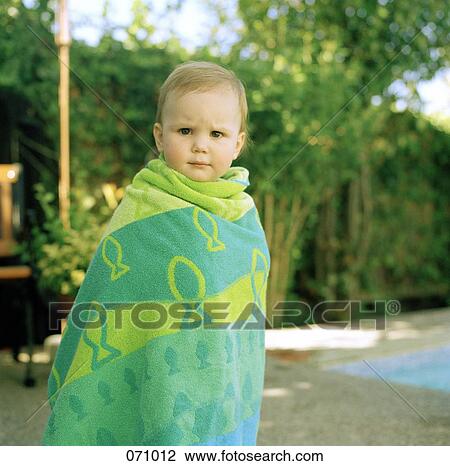 A child wrapped in a towel View Large Photo Image Stock Image - A child wrapped in a towel. Fotosearch