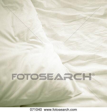 A pillow on a bed View Large Photo Image Stock Image - A pillow on a bed. Fotosearch
