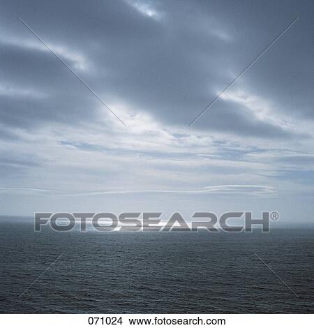 Dark clouds over the ocean View Large Photo Image Picture - Dark clouds over the ocean. Fotosearch