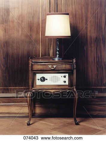 A lamp on a side table View Large Photo Image Stock Image - A lamp on a side table. Fotosearch