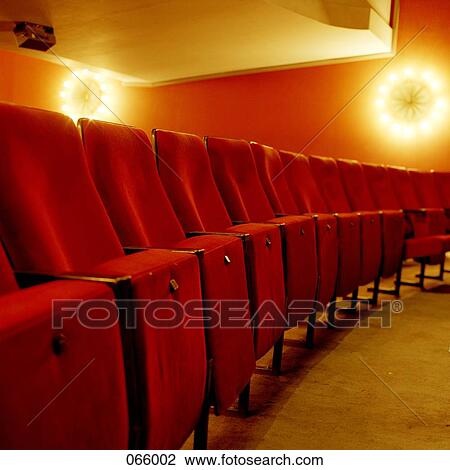 A row of seats in a theater View Large Photo Image Stock Image - A row of seats in a theater. Fotosearch