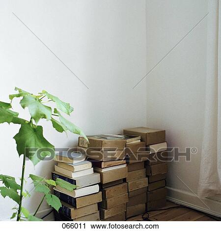 Stock Image - Books stacked in a corner. Fotosearch