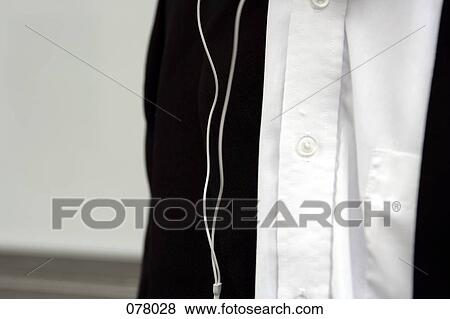 A man with a headphone wire View Large Photo Image Stock Photo - A man with a headphone wire. Fotosearch