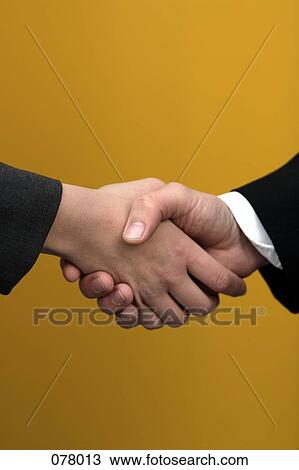 Two businesspeople shaking hands View Large Photo Image Stock Image - Two businesspeople shaking hands. Fotosearch