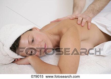 A massage therapist massaging a woman's back View Large Photo Image Stock Photography - A massage therapist massaging a woman's back. Fotosearch