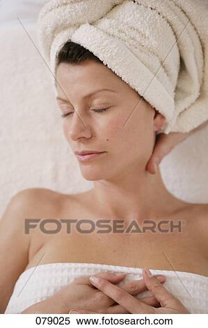 A massage therapist massaging a woman's neck View Large Photo Image Stock Photography - A massage therapist massaging a woman's neck. Fotosearch