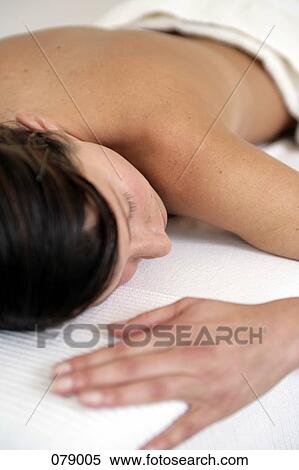 A woman lying down View Large Photo Image Stock Photography - A woman lying down . Fotosearch