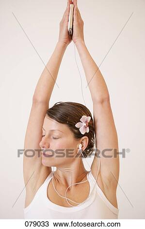 A woman stretching her arms View Large Photo Image Stock Image - A woman stretching her arms. Fotosearch