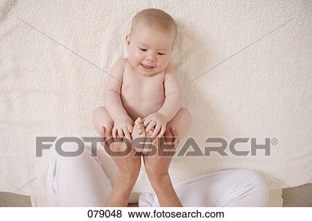 An adult playing with a child View Large Photo Image Stock Photo - An adult playing with a child . Fotosearch