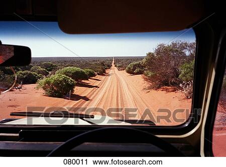 A view of a desert road in Australia through the windshield of an off-road vehicle View Large Photo Image Stock Image - A view of a desert road in Australia through the windshield of an off-road vehicle. Fotosearch