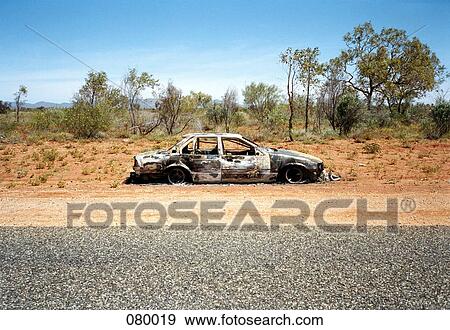 An abandoned car on the side of a desert road, Australia View Large Photo Image Stock Photo - An abandoned car on the side of a desert road, Australia. Fotosearch