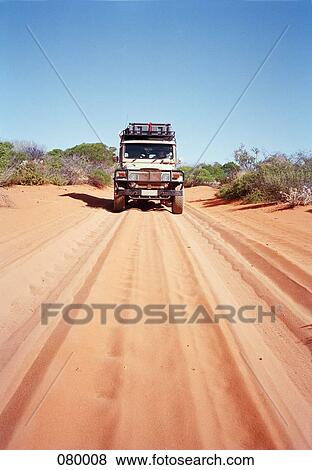 An off-road vehicle on a desert road in Australia View Large Photo Image Stock Photo - An off-road vehicle on a desert road in Australia. Fotosearch